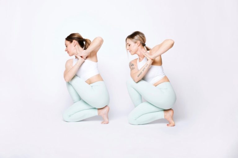 Two women participating in yoga poses against a plain white background